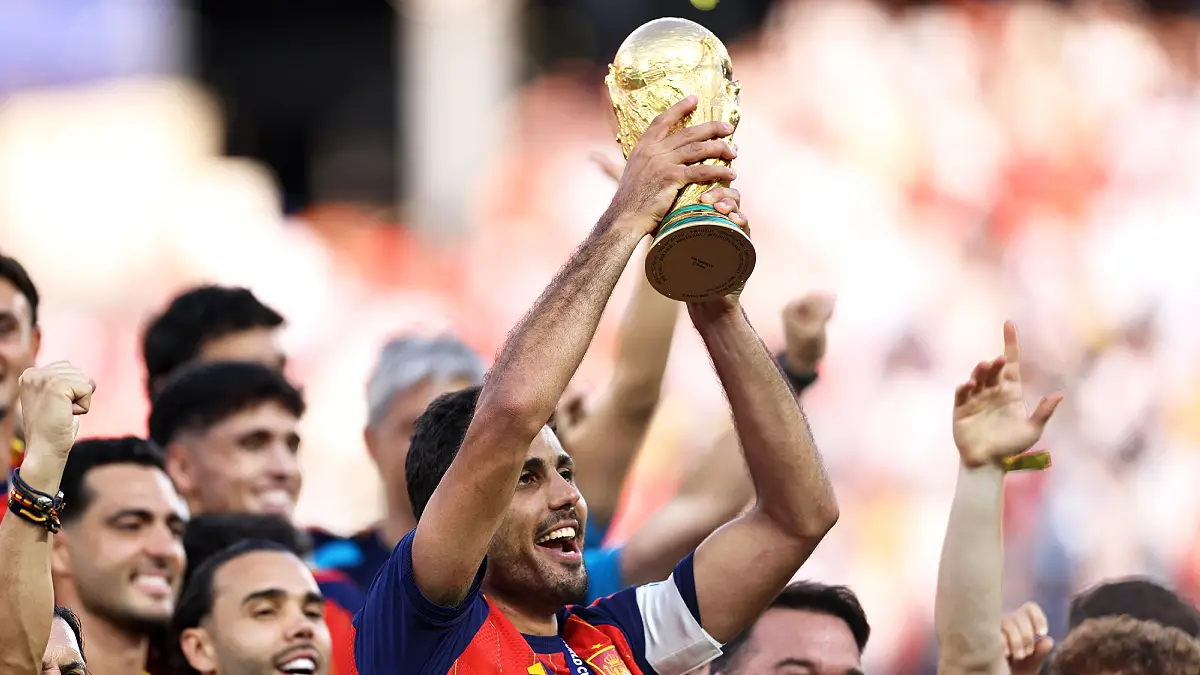 EAST RUTHERFORD, NEW JERSEY - JULY 19: Rodri #16 of Spain lifts the FIFA World Cup Winner’s Trophy after the team’s victory following the FIFA World Cup 2026 Final match between Spain and Argentina at New York New Jersey Stadium on July 19, 2026 in East Rutherford, New Jersey. (Photo by Buda Mendes/Getty Images)