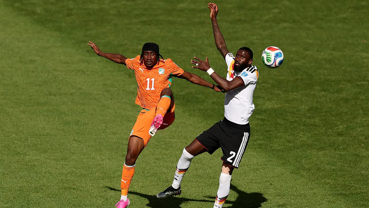 TORONTO, ONTARIO - JUNE 20: Yan Diomande #11 of Cote d'Ivoire and Antonio Ruediger #2 of Germany compete for the ball during the FIFA World Cup 2026 Group E match between Germany and Cote D'Ivoire at Toronto Stadium on June 20, 2026 in Toronto, Ontario. (Photo by Megan Briggs/Getty Images)