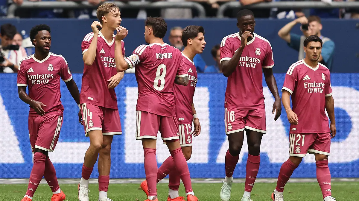 GELSENKIRCHEN, GERMANY - AUGUST 16: Dean Huijsen of Real Madrid (2nd L) celebrates the second goal during the Pre-Season Friendly match between FC Schalke 04 and Real Madrid at Veltins Arena on August 16, 2026 in Gelsenkirchen, Germany. (Photo by Christof Koepsel/Getty Images)
