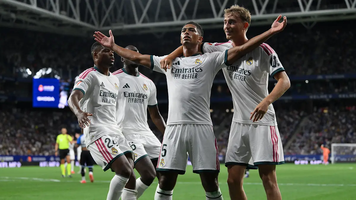 BARCELONA, SPAIN - AUGUST 22: Jude Bellingham of Real Madrid celebrates scoring his team’s first goal with Dean Huijsen during the LaLiga EA Sports 2026/27 match between RCD Espanyol de Barcelona and Real Madrid at RCDE Stadium on August 22, 2026 in Barcelona, Spain. (Photo by David Ramos/Getty Images)