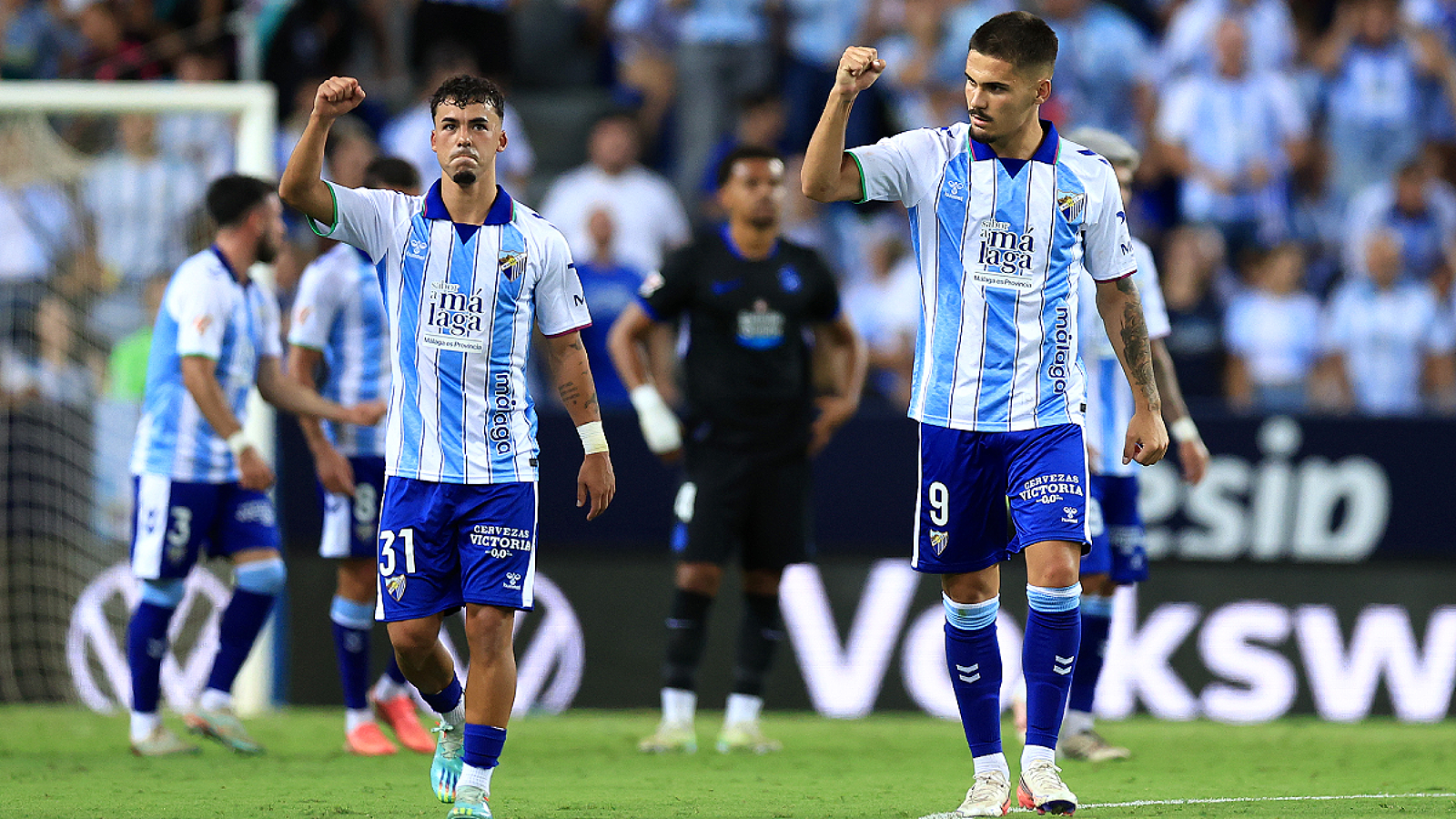 MALAGA, SPAIN - AUGUST 24: Chupete of Malaga celebrates scoring his team’s first goal with teammate Rafael Garrido Hierro during the LaLiga EA Sports 2026/27 match between Malaga CF and RC Deportivo de A Coruna at Estadio La Rosaleda on August 24, 2026 in Malaga, Spain. (Photo by Fran Santiago/Getty Images)