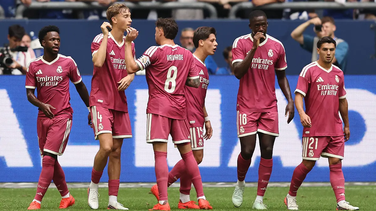 GELSENKIRCHEN, GERMANY - AUGUST 16: Dean Huijsen of Real Madrid (2nd L) celebrates the second goal during the Pre-Season Friendly match between FC Schalke 04 and Real Madrid at Veltins Arena on August 16, 2026 in Gelsenkirchen, Germany. (Photo by Christof Koepsel/Getty Images)