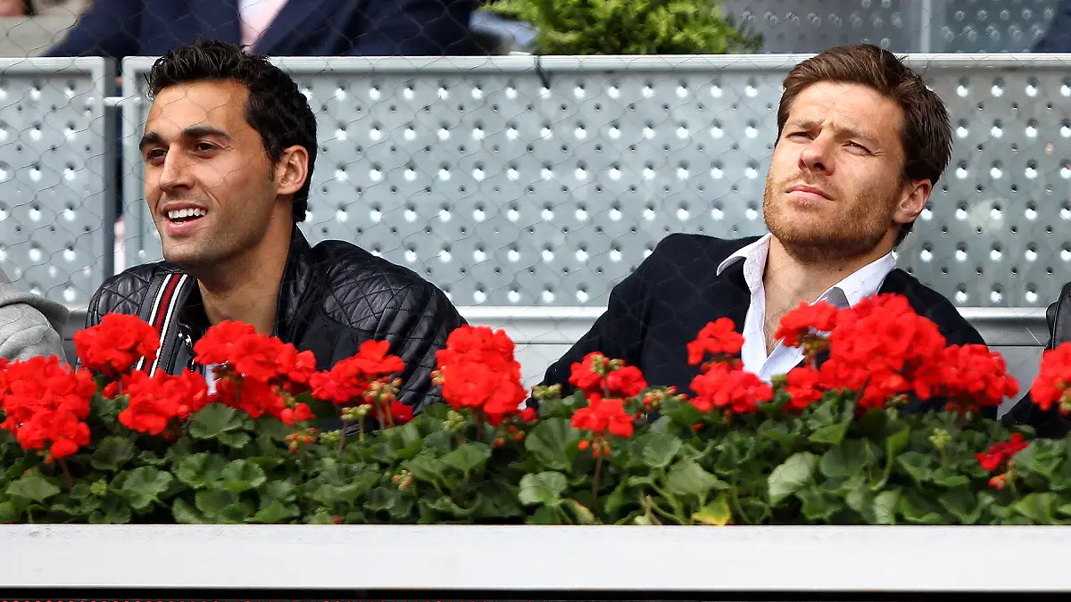 MADRID, SPAIN - MAY 14: Real Madrid soccer players Alvaro Arbeloa and Xabi Alonso watches Rafael Nadal of Spain against Gael Monfils of France in their quarter final match during the Mutua Madrilena Madrid Open tennis tournament at the Caja Magica on May 14, 2010 in Madrid, Spain. (Photo by Clive Brunskill/Getty Images)