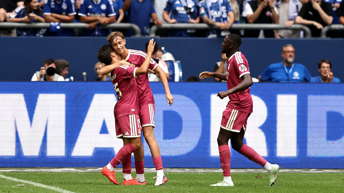 GELSENKIRCHEN, GERMANY - AUGUST 16: Dean Huijsen of Real Madrid celebrates scoring his team’s second goal with teammates Arda Guler and Ibrahima Konate during the Pre-Season Friendly match between FC Schalke 04 and Real Madrid at Veltins Arena on August 16, 2026 in Gelsenkirchen, Germany. (Photo by Christof Koepsel/Getty Images)