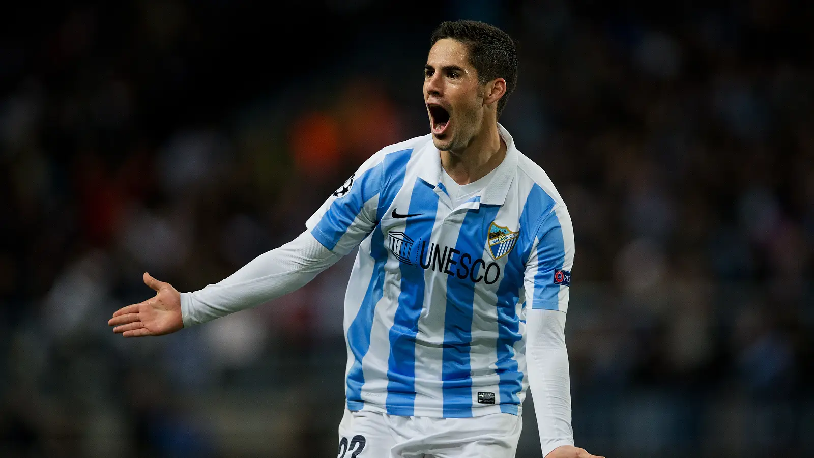 MALAGA, SPAIN - MARCH 13: Isco of Malaga CF celebrates scoring his sides opening goal during the UEFA Champions League Round of 16 second leg match between Malaga CF and FC Porto at La Rosaleda Stadium on March 13, 2013 in Malaga, Spain. (Photo by Jasper Juinen/Getty Images)