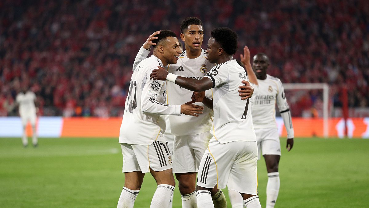 MUNICH, GERMANY - APRIL 15: Kylian Mbappe of Real Madrid celebrates scoring his team's third goal with teammates Jude Bellingham and Vinicius Junior during the UEFA Champions League 2025/26 Quarter-Final Second Leg match between FC Bayern München and Real Madrid CF at Football Arena Munich on April 15, 2026 in Munich, Germany. (Photo by Adam Pretty/Getty Images)