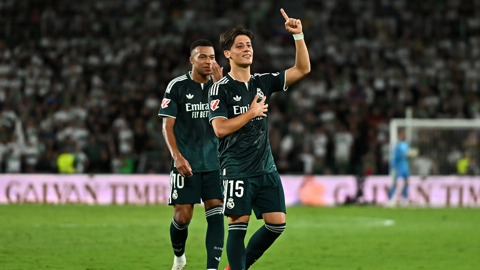 ELCHE, SPAIN - SEPTEMBER 15: Arda Guler of Real Madrid celebrates his team’s first goal which was an own goal scored by Matias Dituro of Elche CF during the LaLiga EA Sports 2026/27 match between Elche CF and Real Madrid at Estadio Manuel Martinez Valero on September 15, 2026 in Elche, Spain. (Photo by Francisco Macia/Getty Images)
