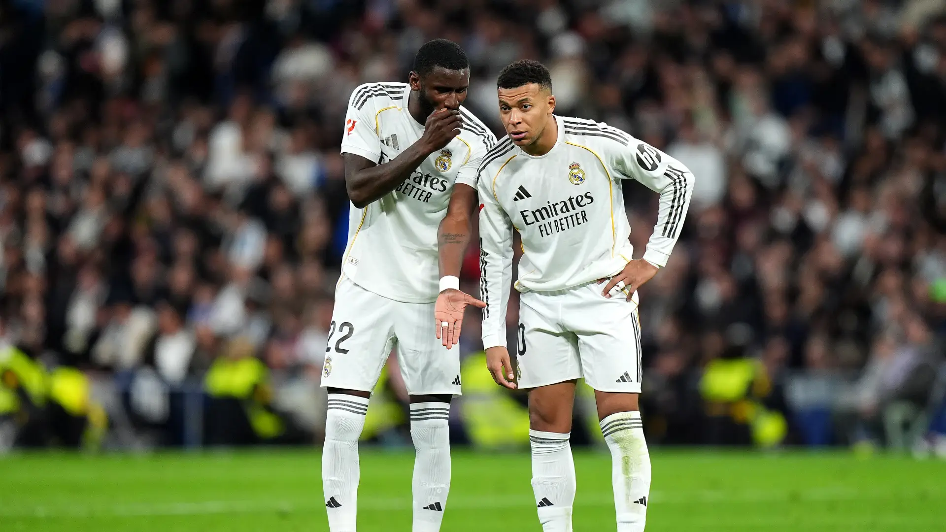 MADRID, SPAIN - DECEMBER 20: Antonio Ruediger (L) and Kylian Mbappe of Real Madrid (R), talk during the LaLiga EA Sports match between Real Madrid CF and Sevilla FC at Estadio Santiago Bernabeu on December 20, 2025 in Madrid, Spain. (Photo by Angel Martinez/Getty Images)