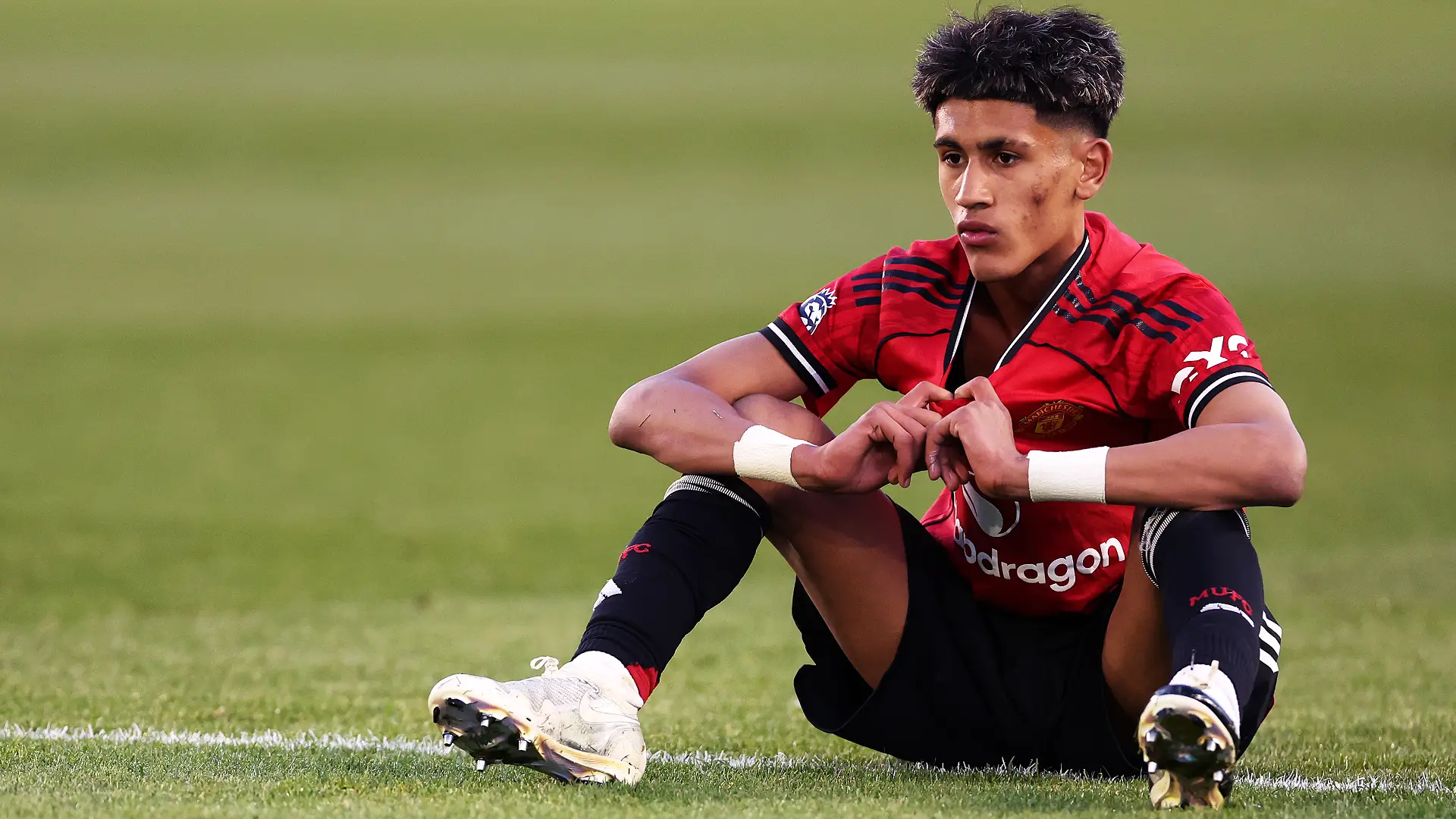 MANCHESTER, ENGLAND - MAY 14: JJ Gabriel of Manchester United looks dejected after the team's defeat during the FA Youth Cup Final match between Manchester City and Manchester United at Joie Stadium on May 14, 2026 in Manchester, England. (Photo by Naomi Baker/Getty Images)