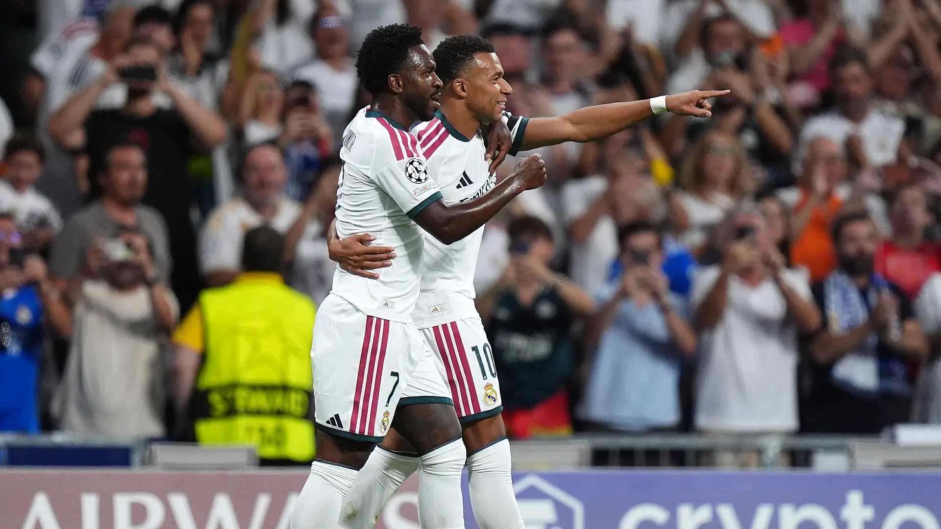 MADRID, SPAIN - SEPTEMBER 08: Kylian Mbappe of Real Madrid celebrates scoring his team’s first goal with teammate Vinicius Junior during the UEFA Champions League 2026/27 League Phase MD1 match between Real Madrid C.F. and FC Internazionale Milano at Estadio Santiago Bernabeu on September 08, 2026 in Madrid, Spain. (Photo by Angel Martinez/Getty Images)