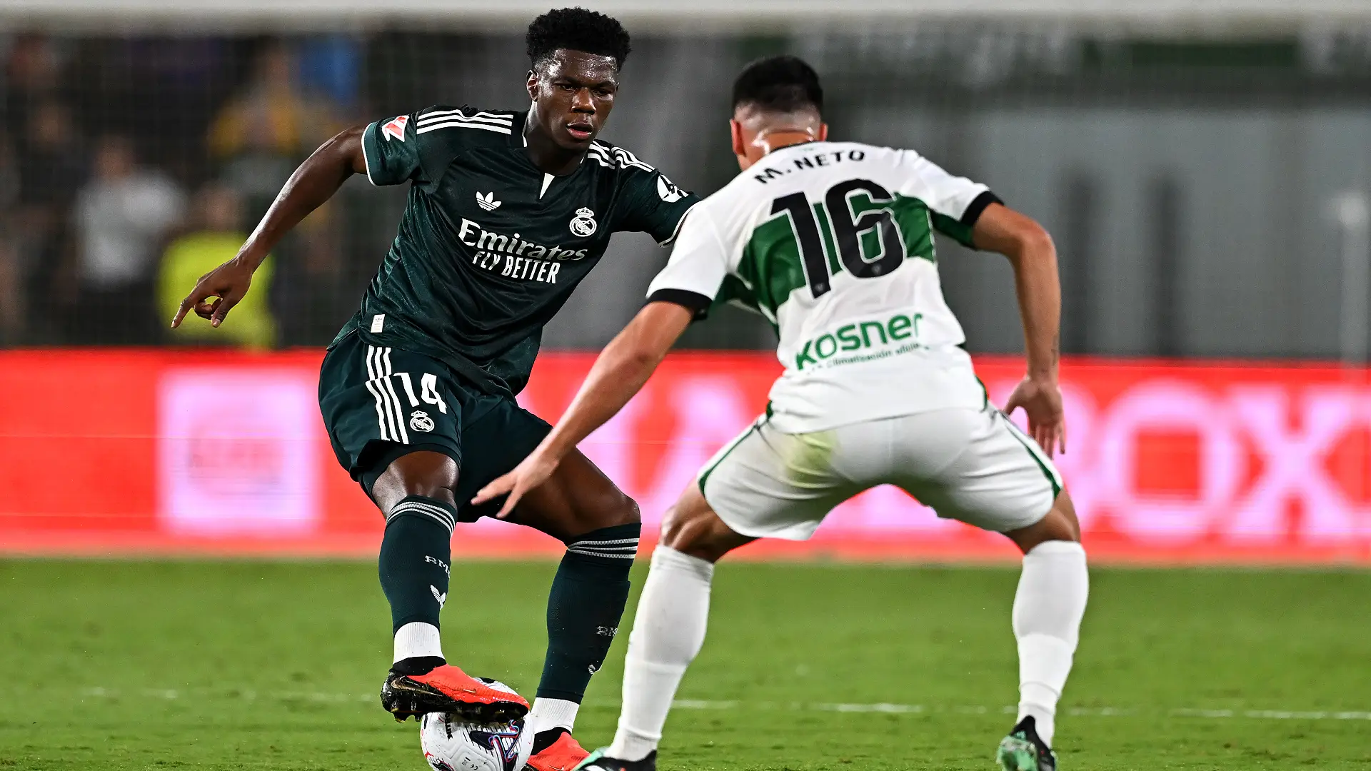 ELCHE, SPAIN - SEPTEMBER 15: Aurelien Tchouameni of Real Madrid is put under pressure from Martim Neto of Elche CF during the LaLiga EA Sports 2026/27 match between Elche CF and Real Madrid at Estadio Manuel Martinez Valero on September 15, 2026 in Elche, Spain. (Photo by Francisco Macia/Getty Images)