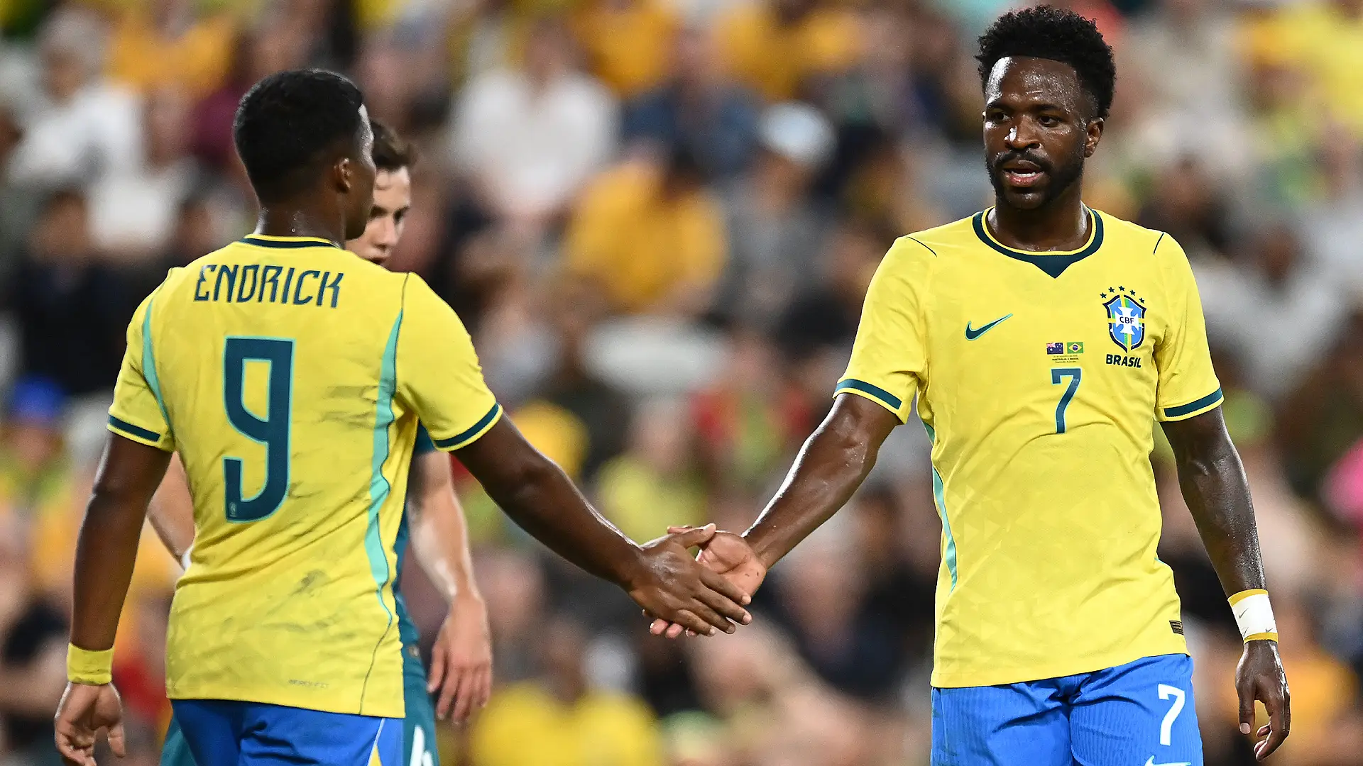TOWNSVILLE, AUSTRALIA - SEPTEMBER 25: Vinicius Jose Paixao de Oliveira Junior of Brazil and Endrick Felipe Moreira de Sousa Pessoa of Brazil shake hands during the International Friendly match between Australia Socceroos and Brazil at Queensland Country Bank Stadium on September 25, 2026 in Townsville, Australia. (Photo by Albert Perez/Getty Images)