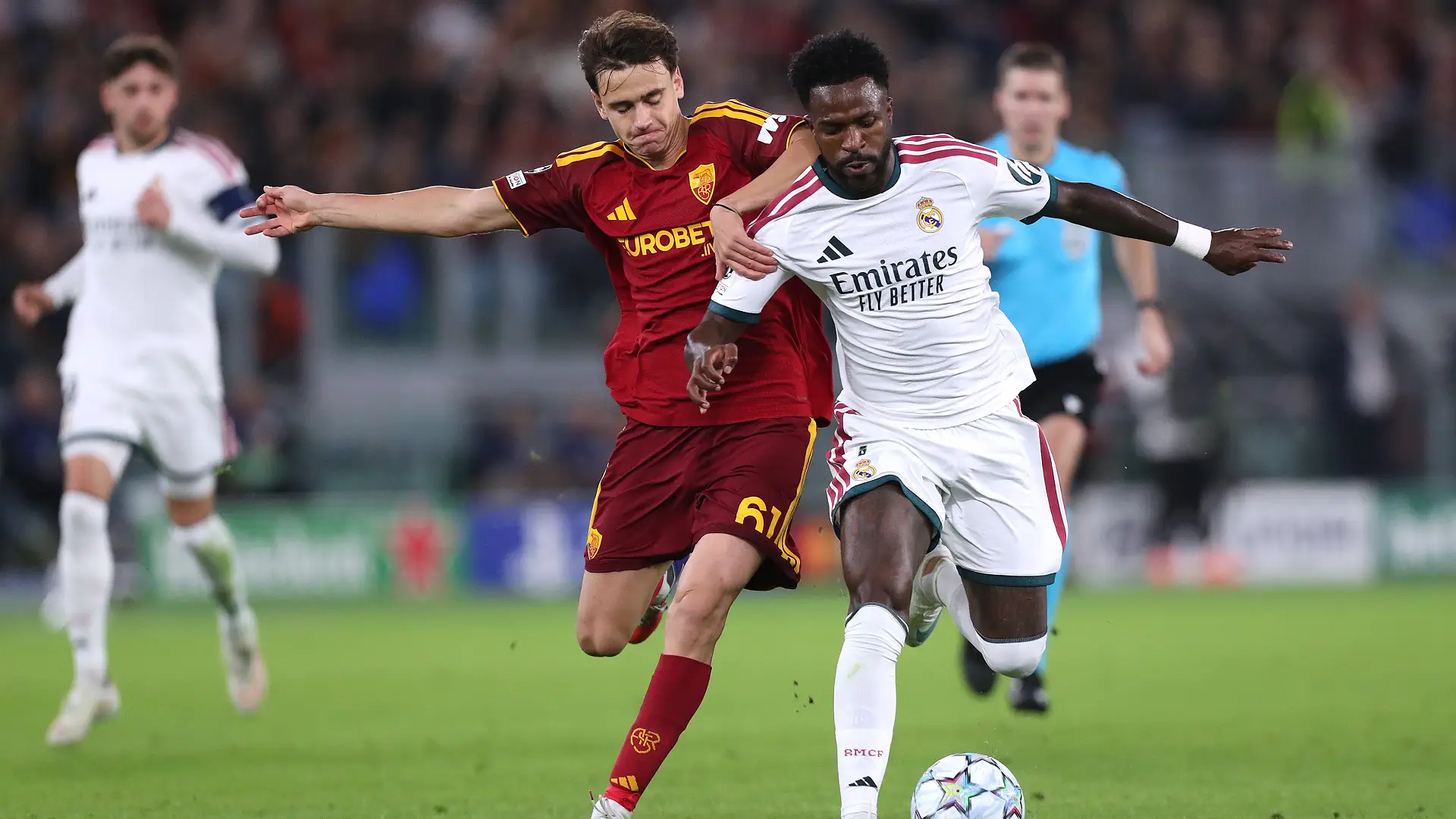 AS Roma v Real Madrid C.F. - UEFA Champions League 2026/27 League Phase MD2 ROME, ITALY - OCTOBER 14: Vinicius Junior of Real Madrid is challenged by Niccolo Pisilli of AS Roma during the UEFA Champions League 2026/27 League Phase MD2 match between AS Roma and Real Madrid C.F. at Stadio Olimpico on October 14, 2026 in Rome, Italy. (Photo by Paolo Bruno/Getty Images)