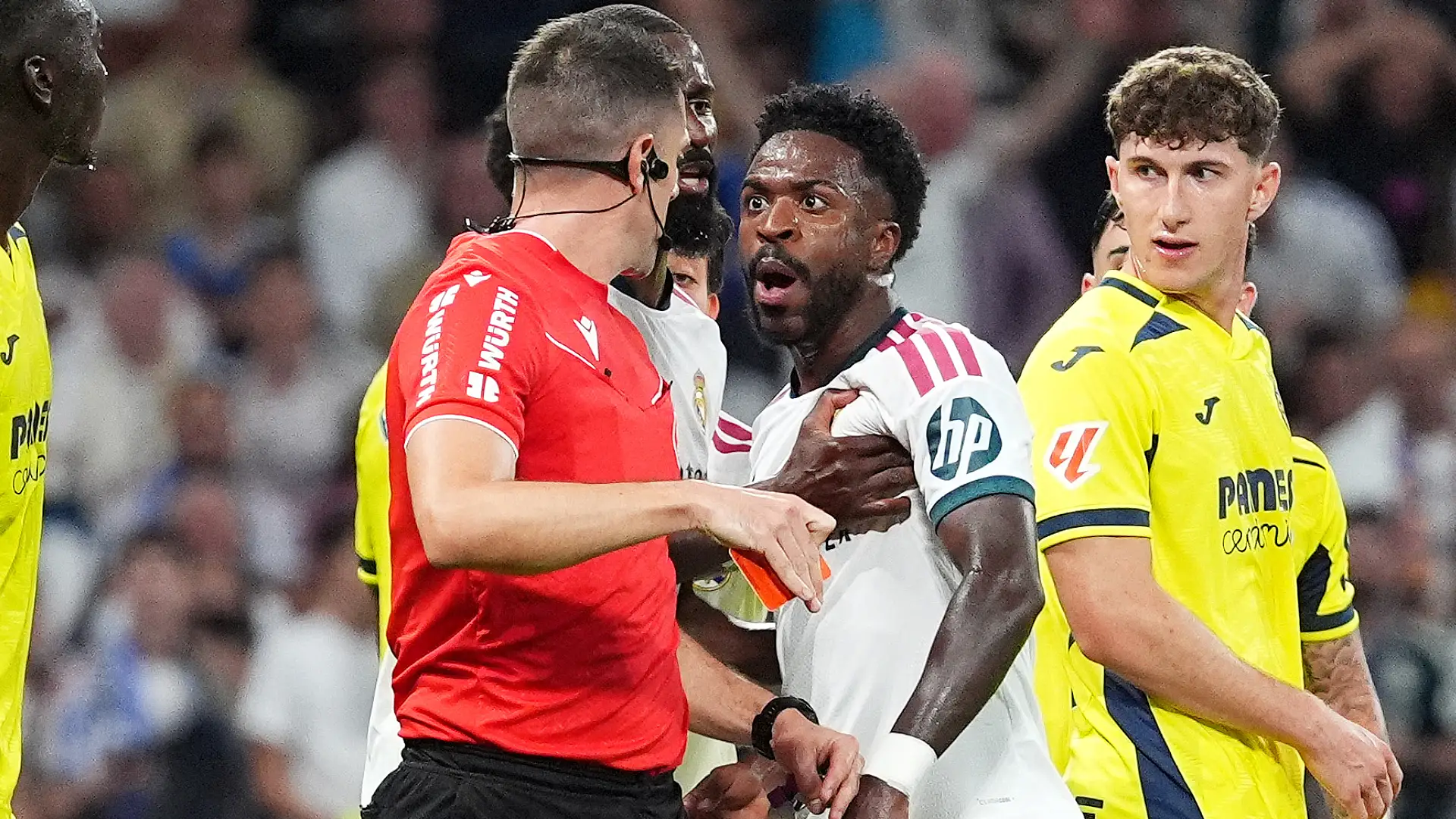MADRID, SPAIN - OCTOBER 10: Vinicius Jr. of Real Madrid receives a red card from referee Isidro Diaz de Mera Escuderos during the LaLiga EA Sports 2026/27 match between Real Madrid and Villarreal CF at Estadio Santiago Bernabeu on October 10, 2026 in Madrid, Spain. (Photo by Angel Martinez/Getty Images)