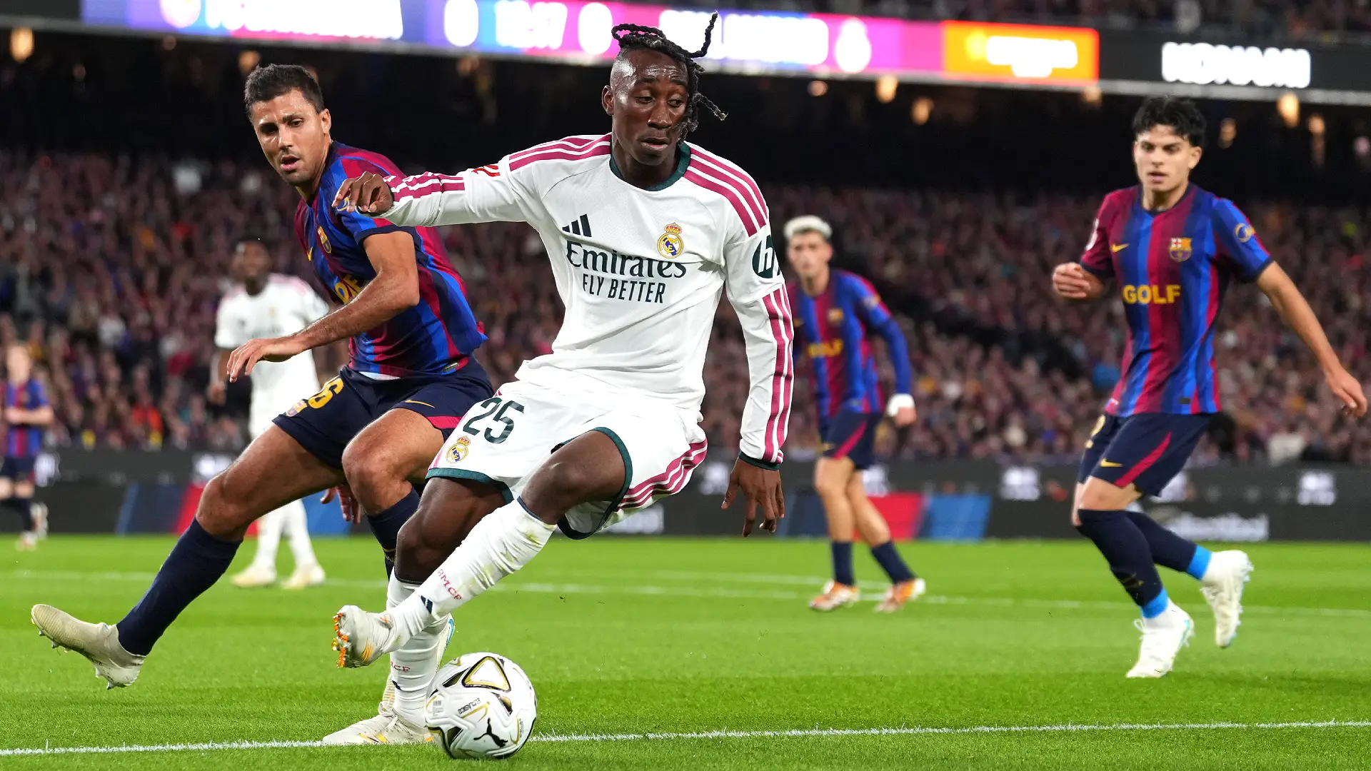 BARCELONA, SPAIN - OCTOBER 25: Yan Diomande of Real Madrid controls the ball under pressure from Rodri of FC Barcelona during the LaLiga EA Sports 2026/27 match between FC Barcelona and Real Madrid at Spotify Camp Nou on October 25, 2026 in Barcelona, Spain. (Photo by Alex Caparros/Getty Images)