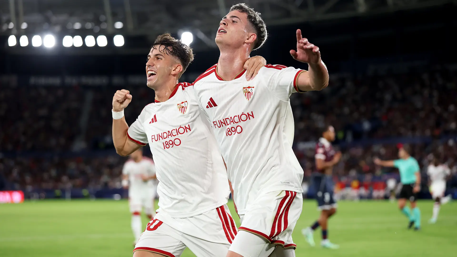VALENCIA, SPAIN - OCTOBER 12: Robbie Ure of Seville FC celebrates scoring his team’s first goal with Miguel Angel Sierra of Sevilla FC during the LaLiga EA Sports 2026/27 match between Levante UD and Sevilla FC at Ciutat de Valencia on October 12, 2026 in Valencia, Spain. (Photo by Clive Brunskill/Getty Images)