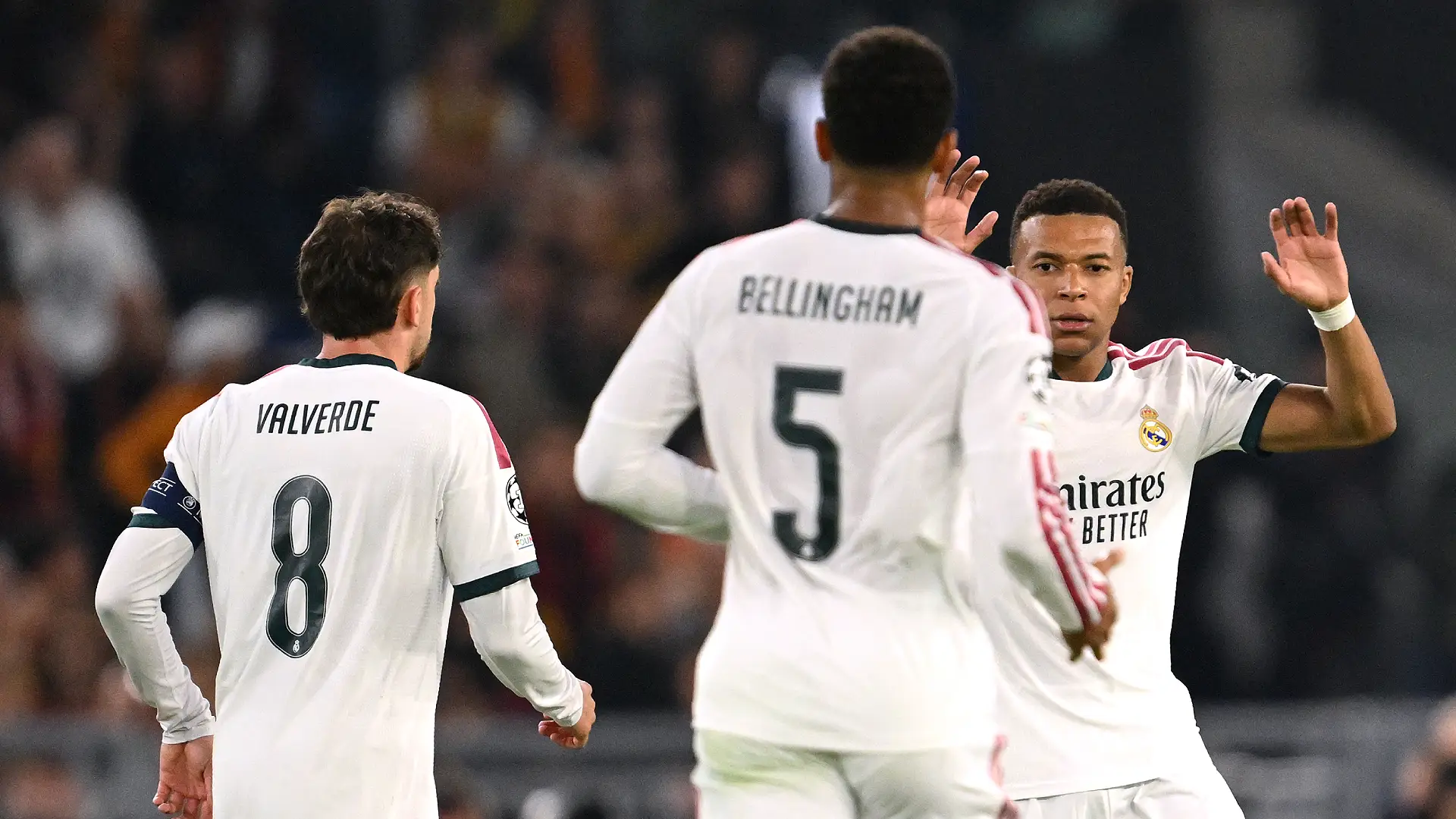 ROME, ITALY - OCTOBER 14: Kylian Mbappe of Real Madrid celebrates scoring his team’s first goal with Federico Valverde and Jude Bellingham during the UEFA Champions League 2026/27 League Phase MD2 match between AS Roma and Real Madrid C.F. at Stadio Olimpico on October 14, 2026 in Rome, Italy. (Photo by Tullio M. Puglia/Getty Images)